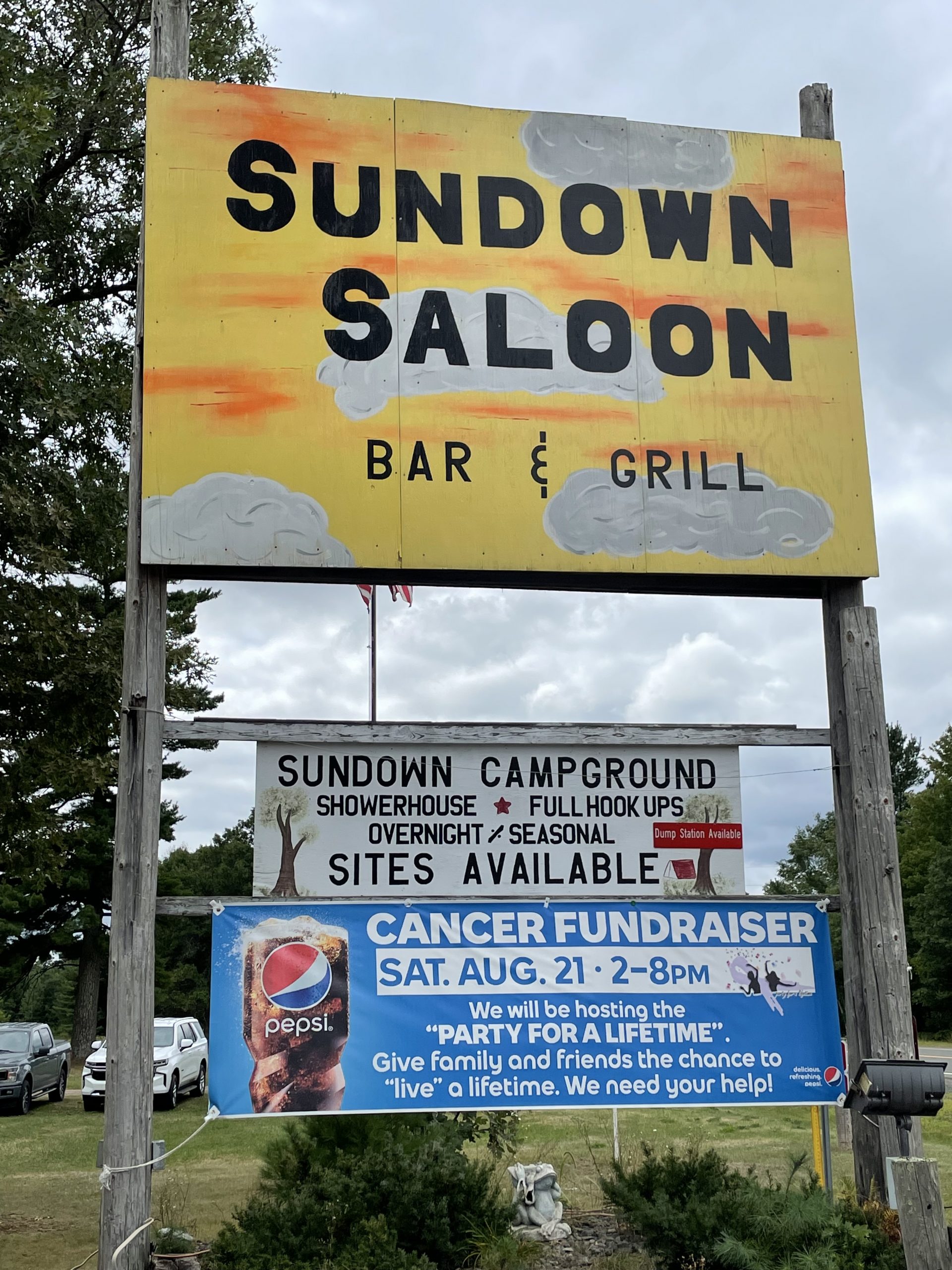 Sundown Saloon sign with Party for a Lifetime cancer fundraiser banner